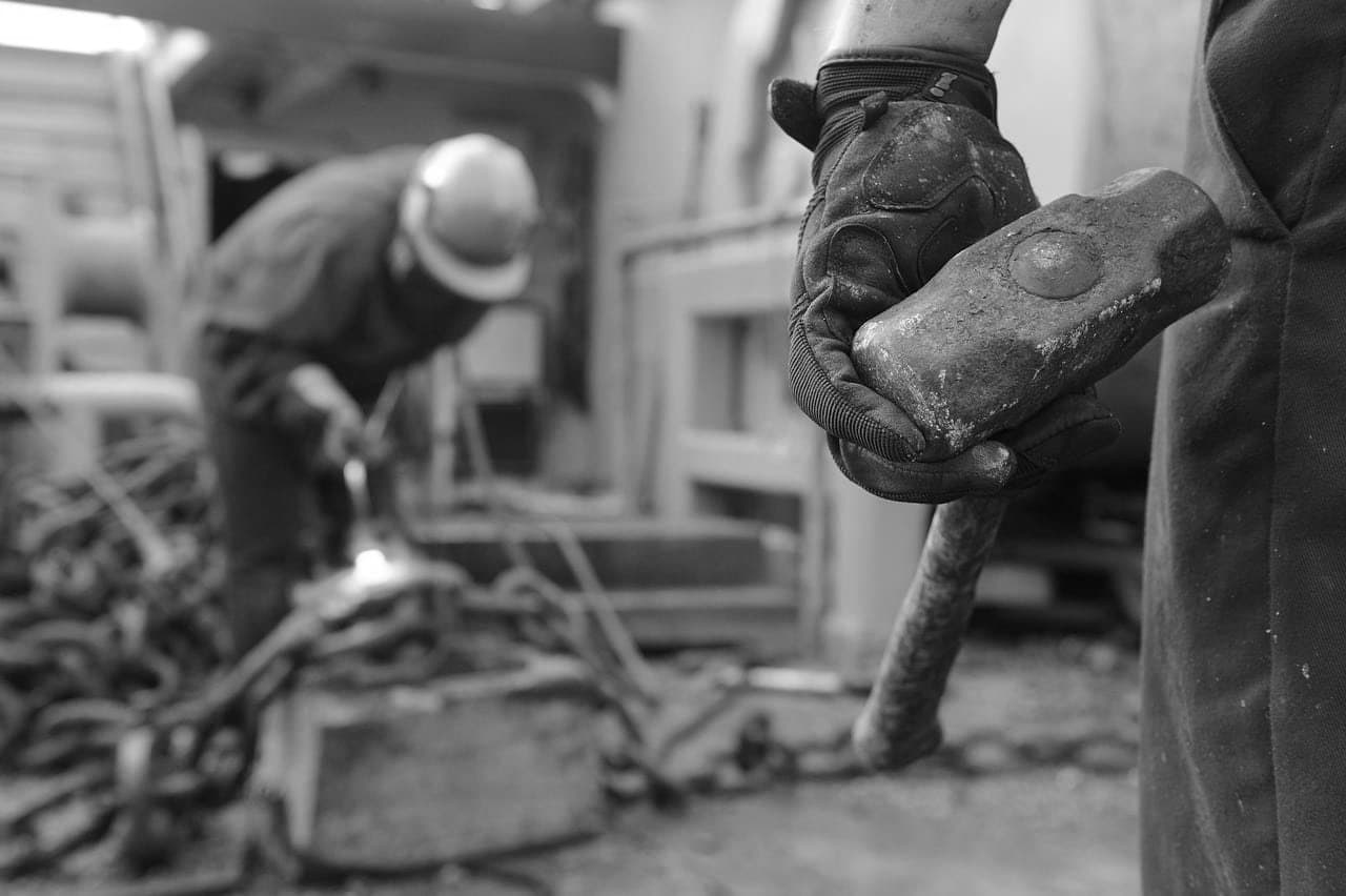Worker holding a hammer